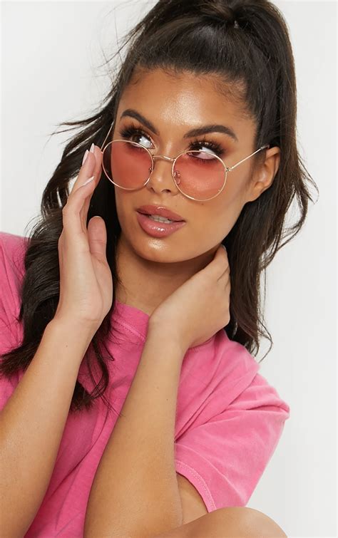 large round pink lens sunglasses.